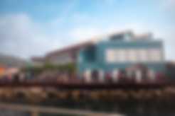 A teal building at the port of Roatan, Honduras