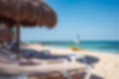 A beach with a pier at Nachi Cocom in Cozumel, Mexico