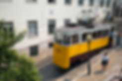 A yellow city trolly in Lisbon, Portugal